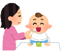 赤ちゃんに離乳食を食べさせている母親のイラスト